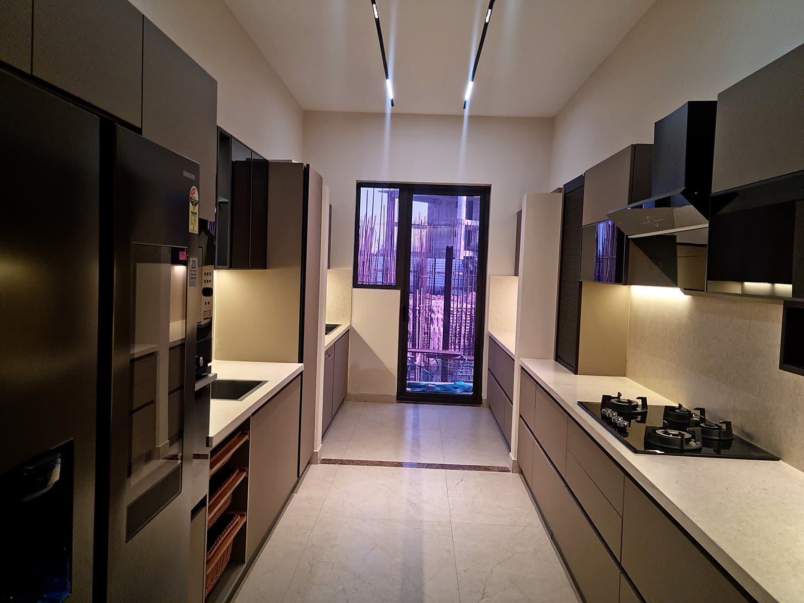Modular parallel kitchen with Samsung appliances and LED track lighting in Mohali property
