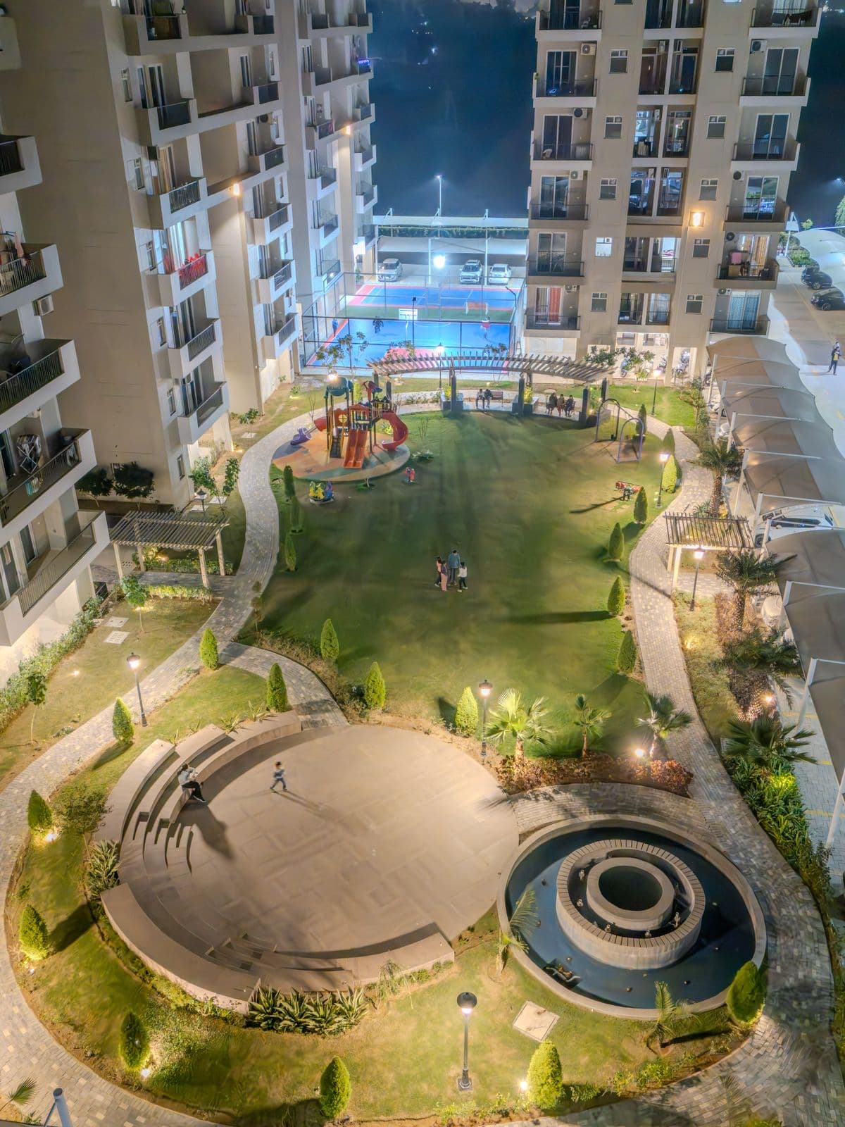 Aerial view of clubhouse with swimming pool and landscaped gardens in Zirakpur