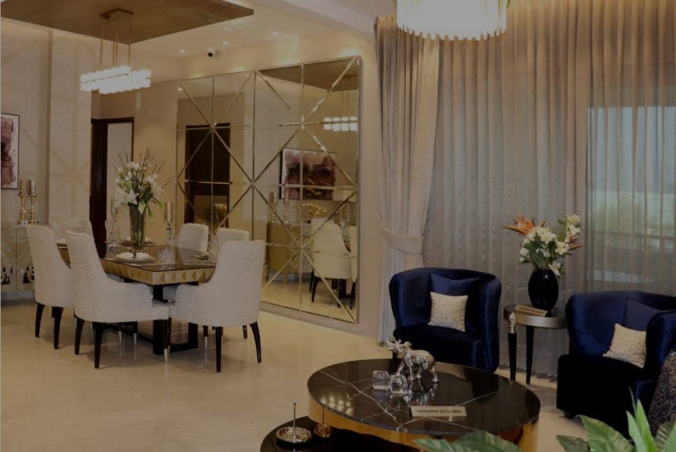 Elegant dining area with mirror wall in premium Zirakpur flat