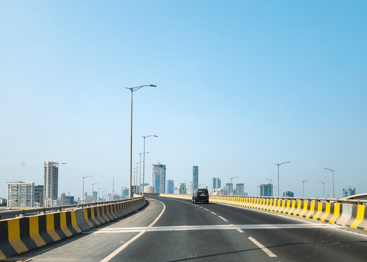 Modern Indian expressway leading to high-rise residential towers