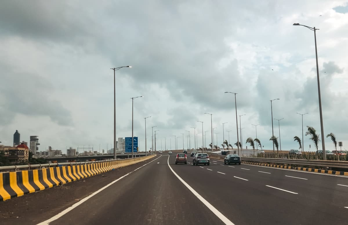 Modern Indian expressway with highway signage and city skyline